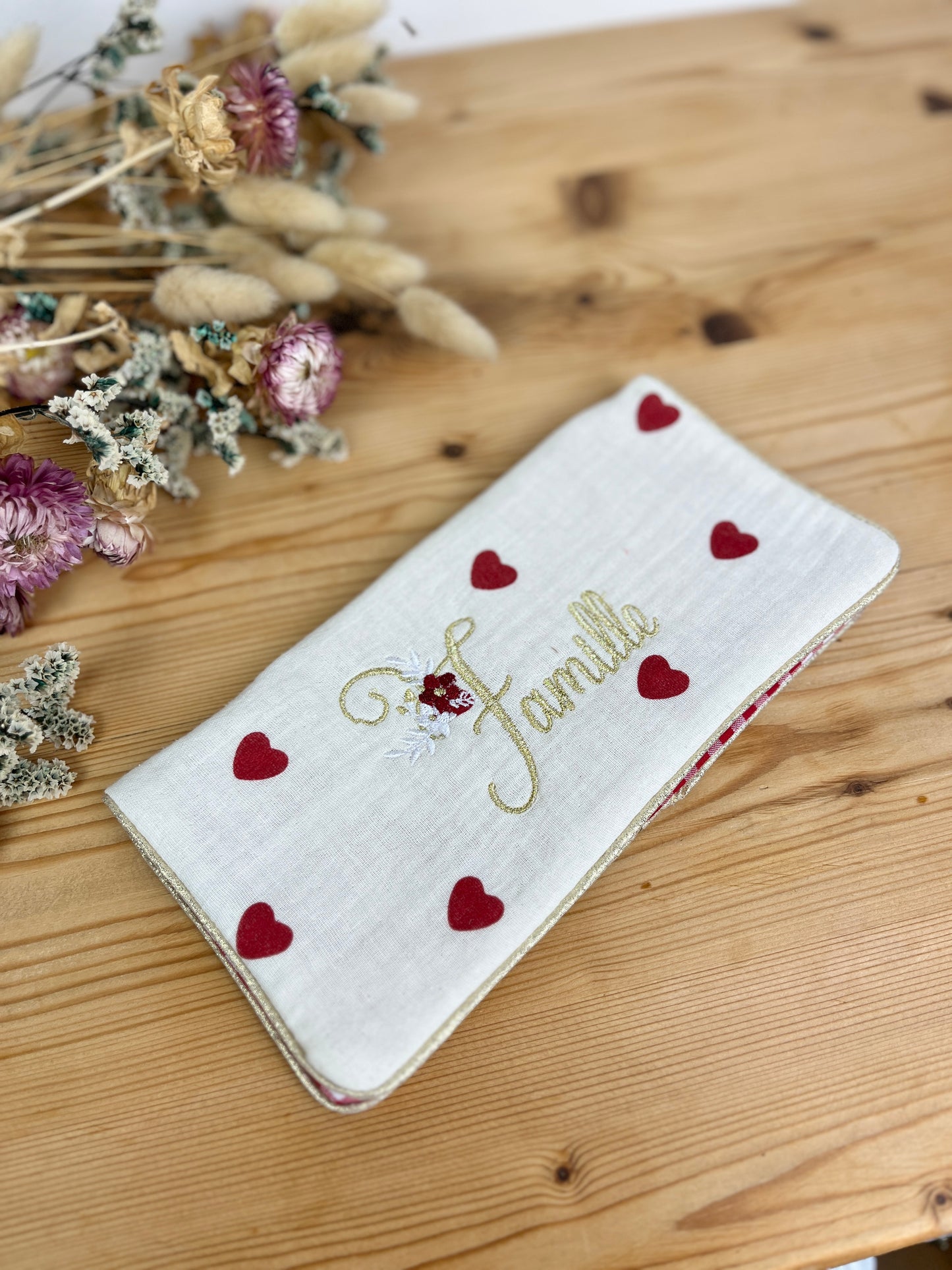 Embroidered family record book cover with heart design