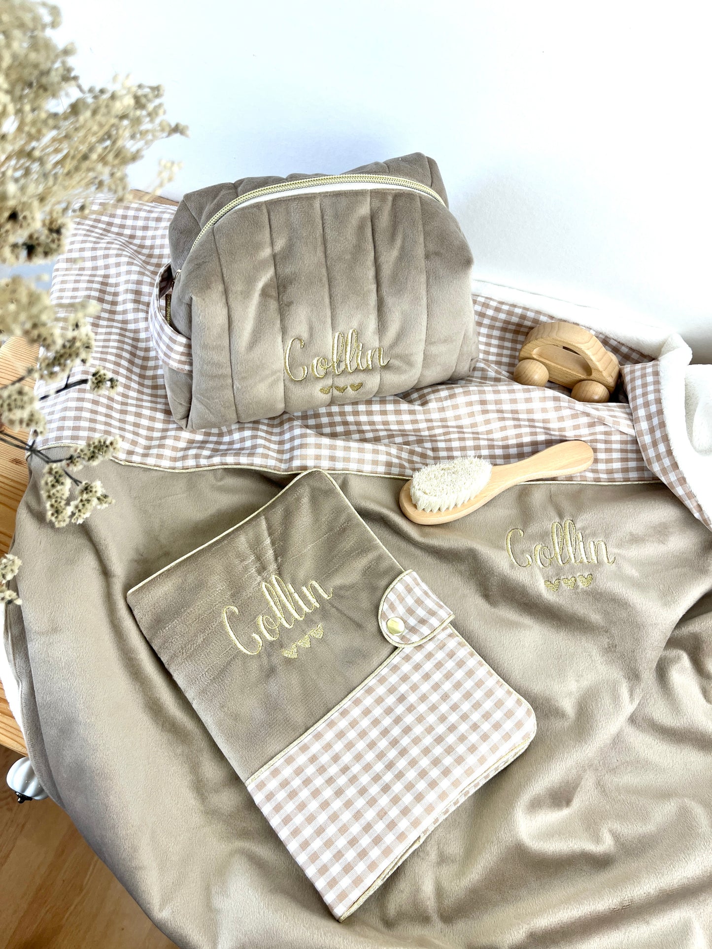 Set includes: Toiletry bag, blanket, doll, notebook cover, and bonnet