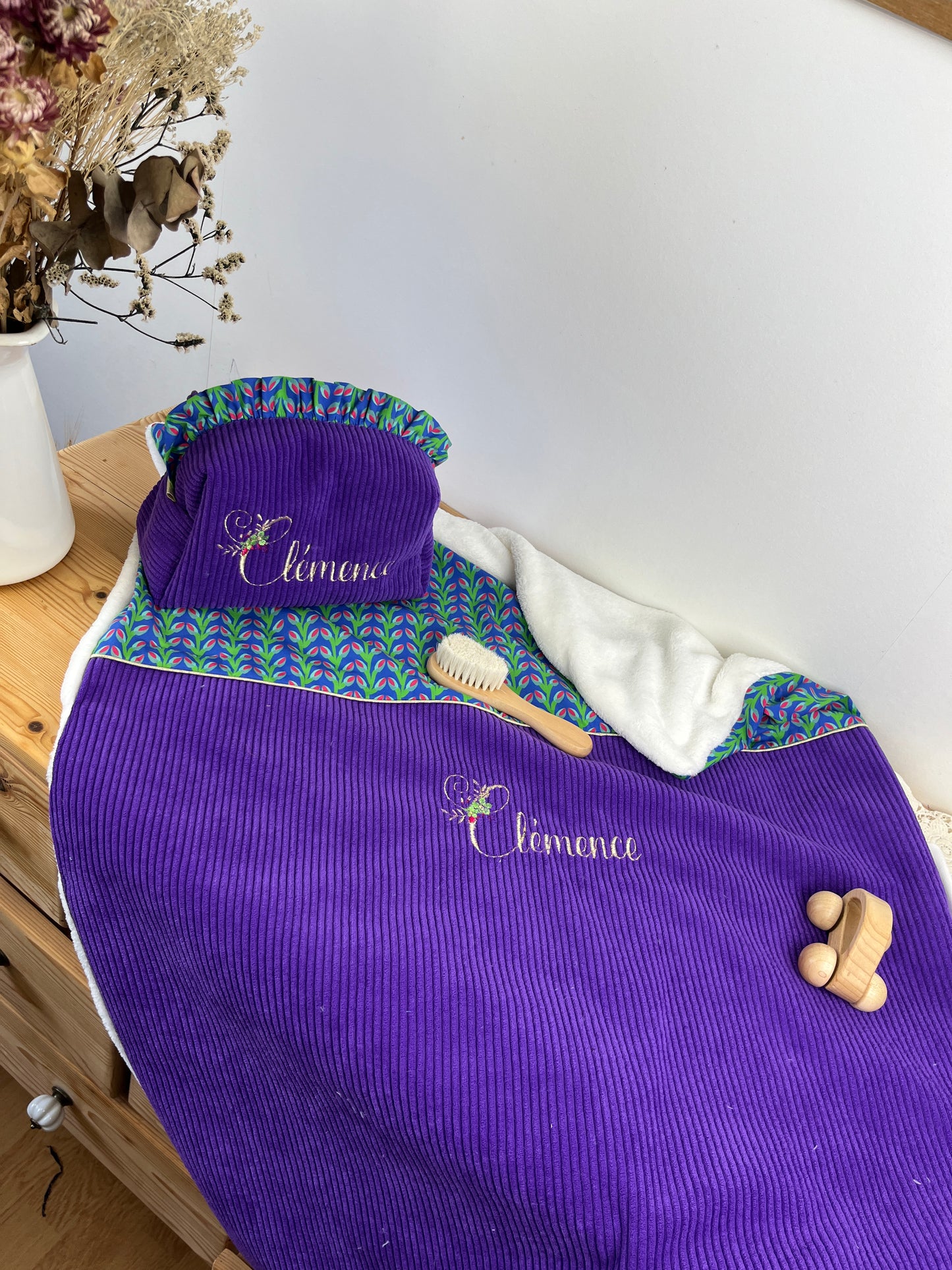 Set includes: Toiletry bag, blanket, doll, notebook cover, and bonnet