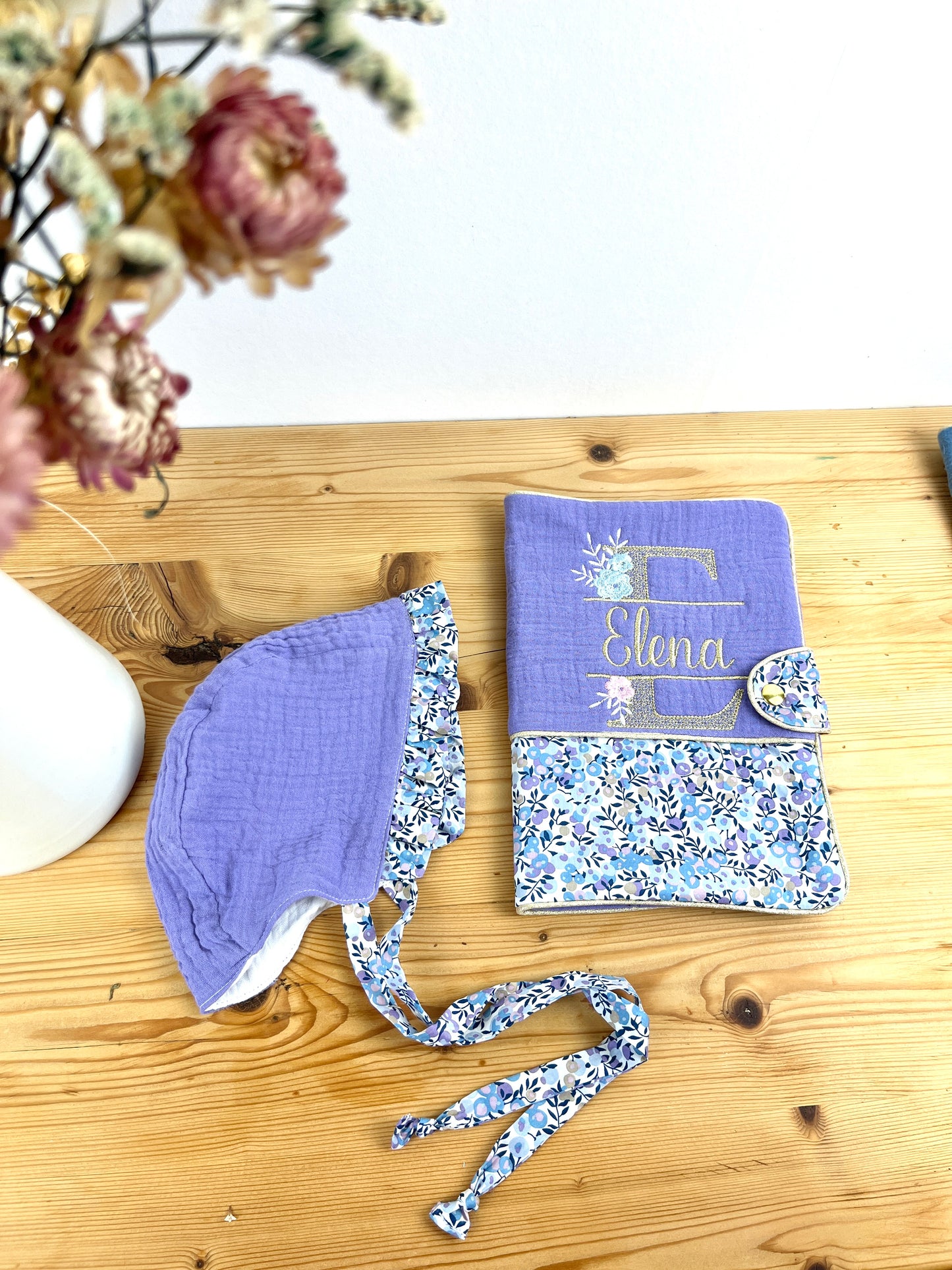 Set: baby bonnet and health record book cover