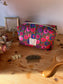 Colette's quilted toiletry bag and its bow