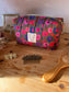 Colette's quilted toiletry bag and its bow