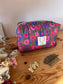 Colette's quilted toiletry bag and its bow