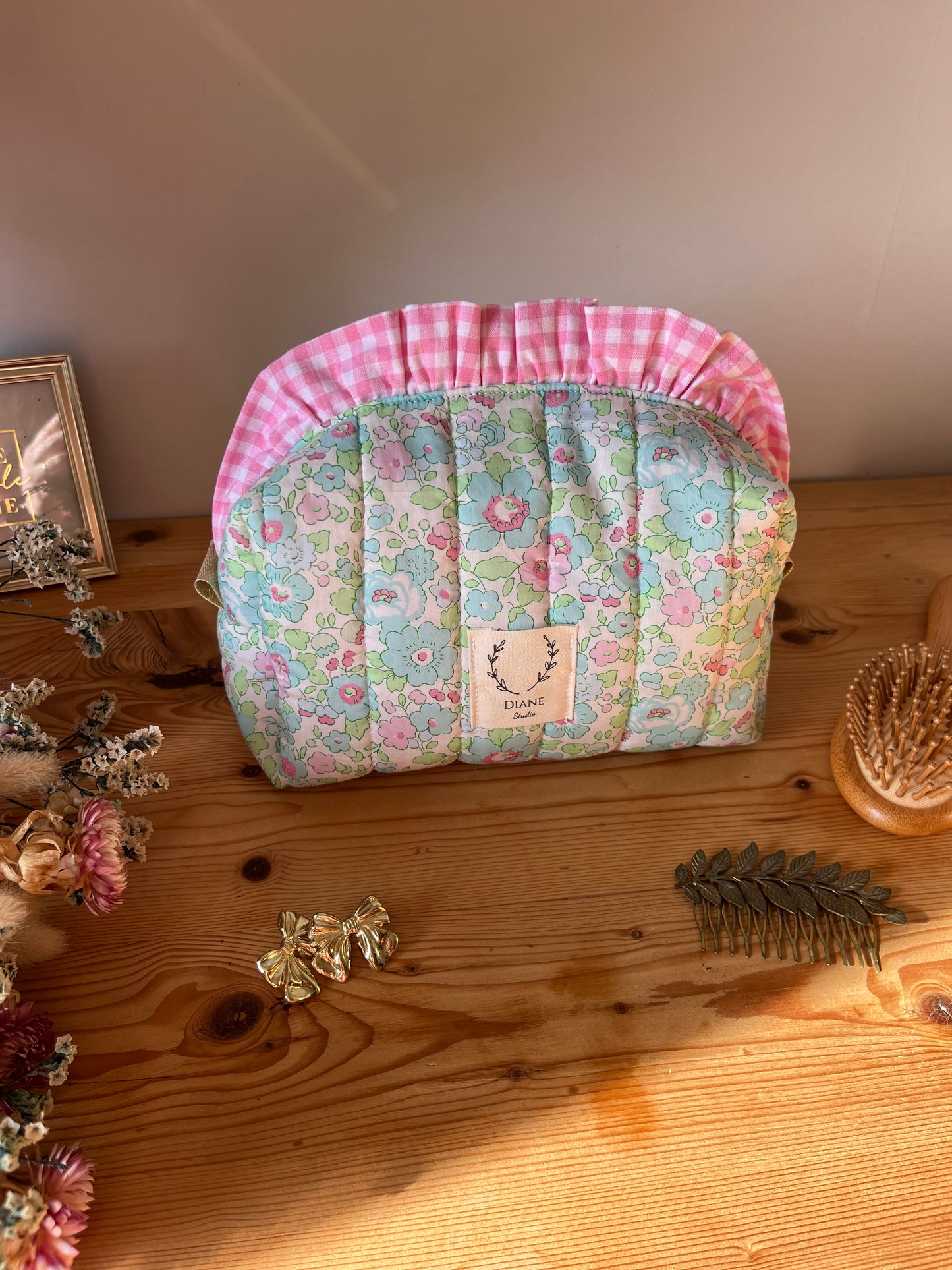 Colette's quilted toiletry bag and its bow