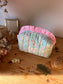Colette's quilted toiletry bag and its bow
