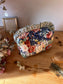 Colette's quilted toiletry bag and its bow