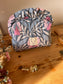 Colette's quilted toiletry bag and its bow
