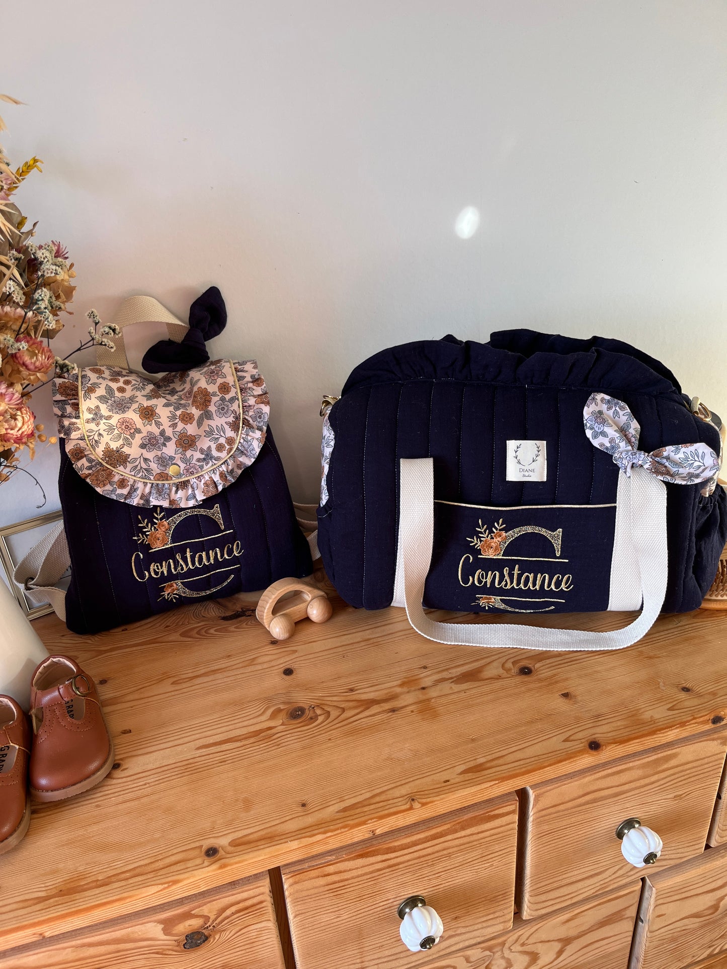Set: Eglantine duffel bag and backpack with initial lace