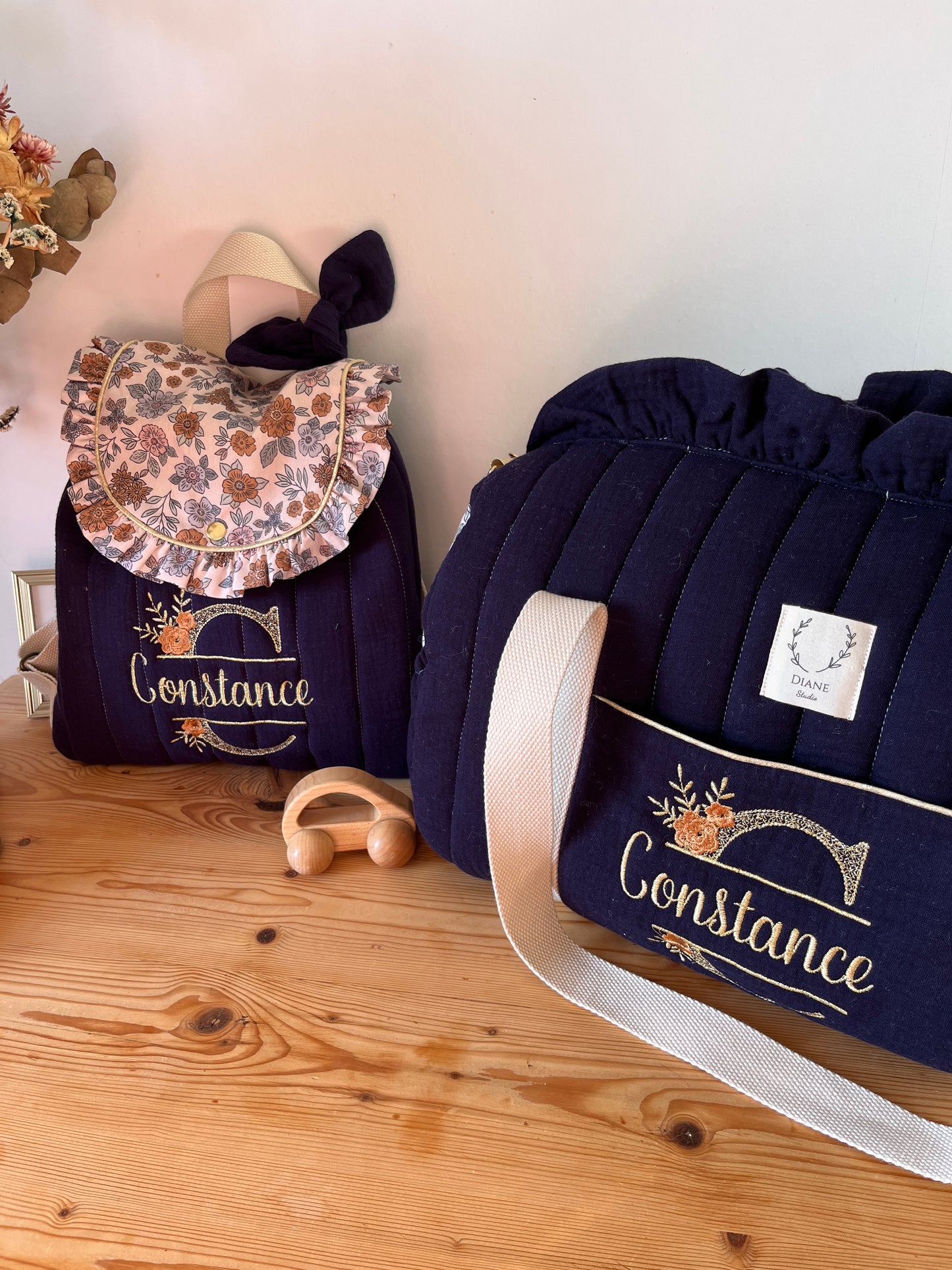 Set: Eglantine duffel bag and backpack with initial lace