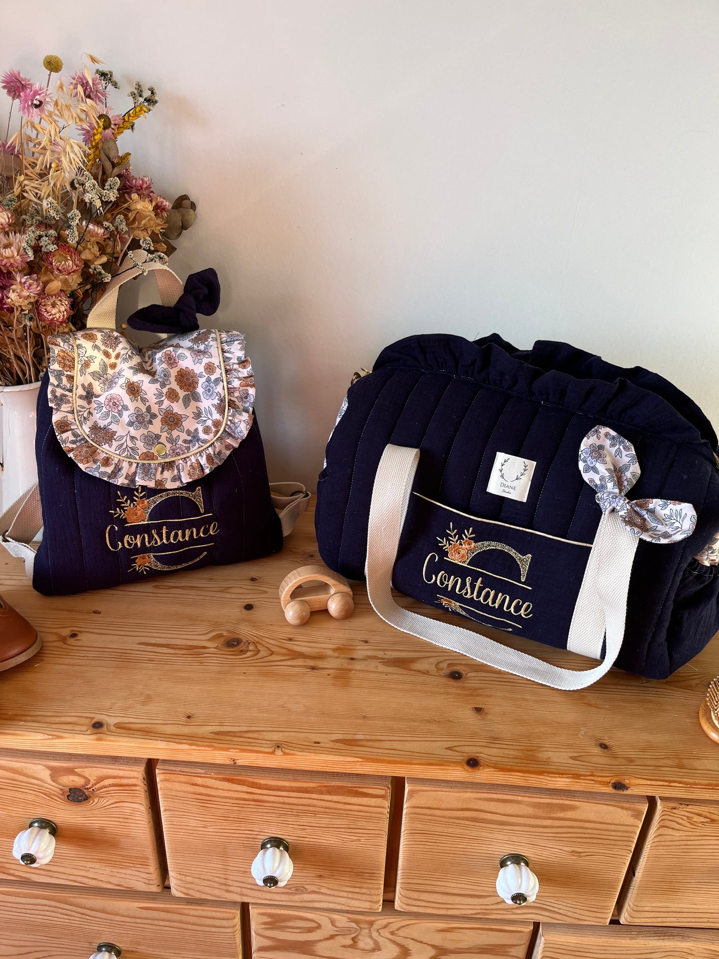 Set: Eglantine duffel bag and backpack with initial lace