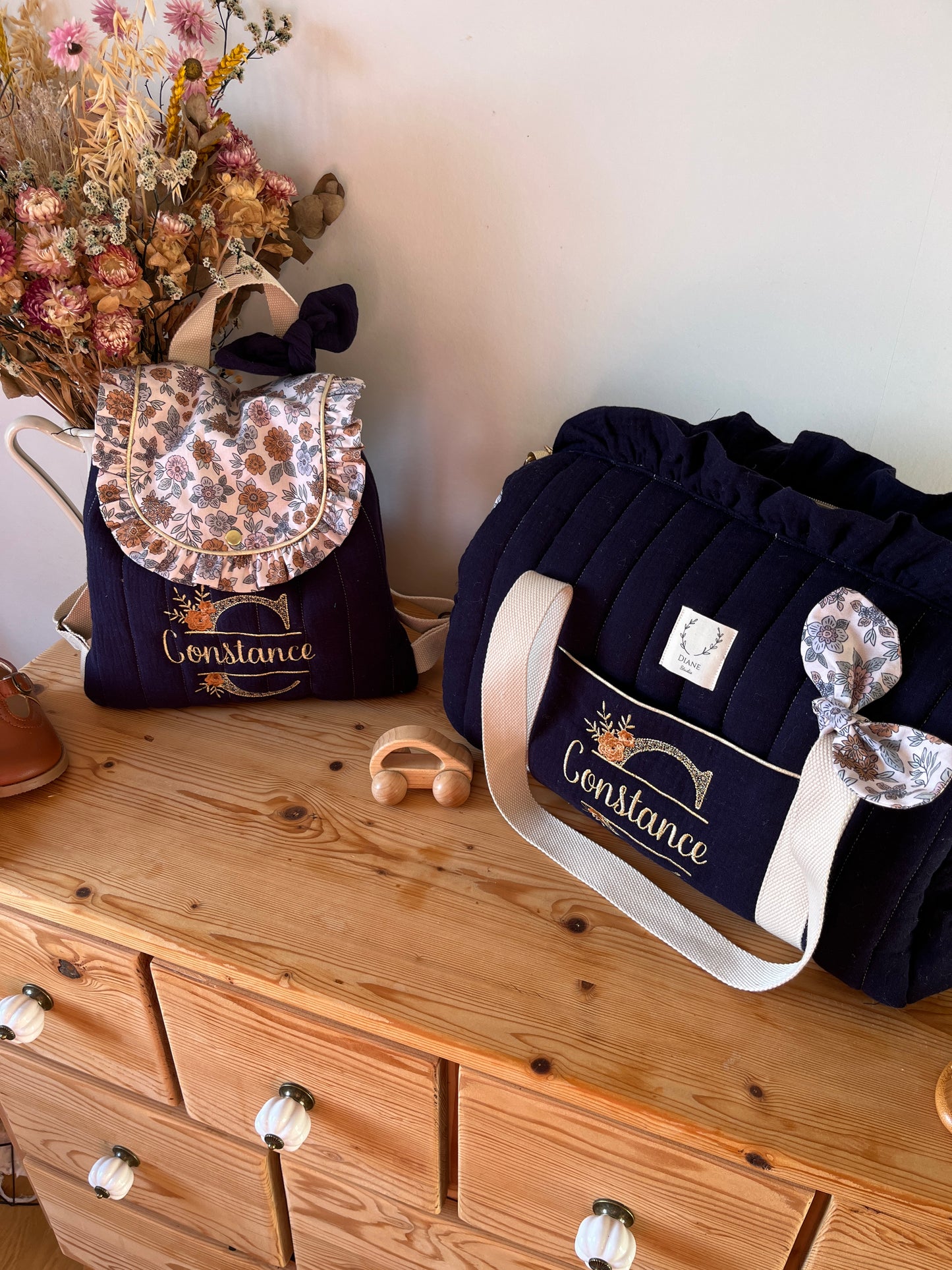 Set: Eglantine duffel bag and backpack with initial lace