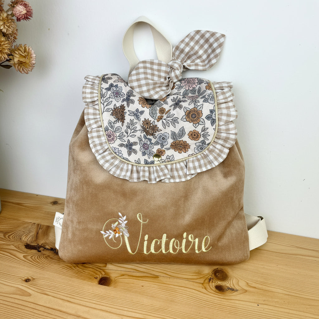 The Eglantine camel velvet backpack and Marion