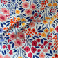 Coupon 1m fleuri fond bleu ciel