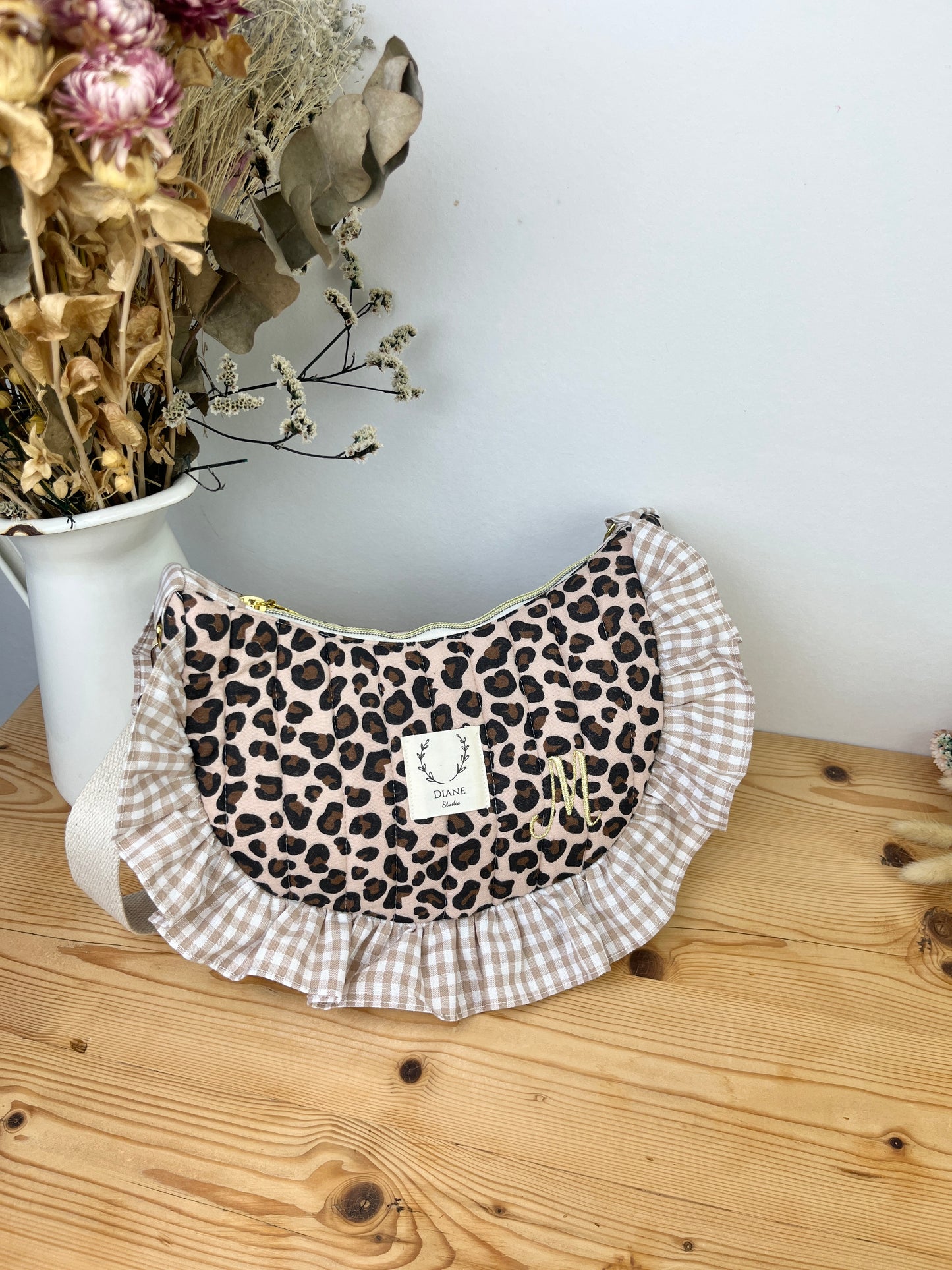 Milan the quilted crescent bag in leopard and beige gingham