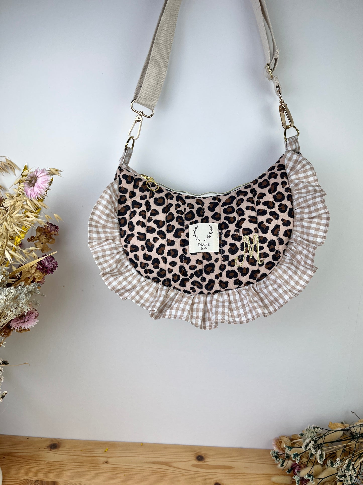Milan the quilted crescent bag in leopard and beige gingham