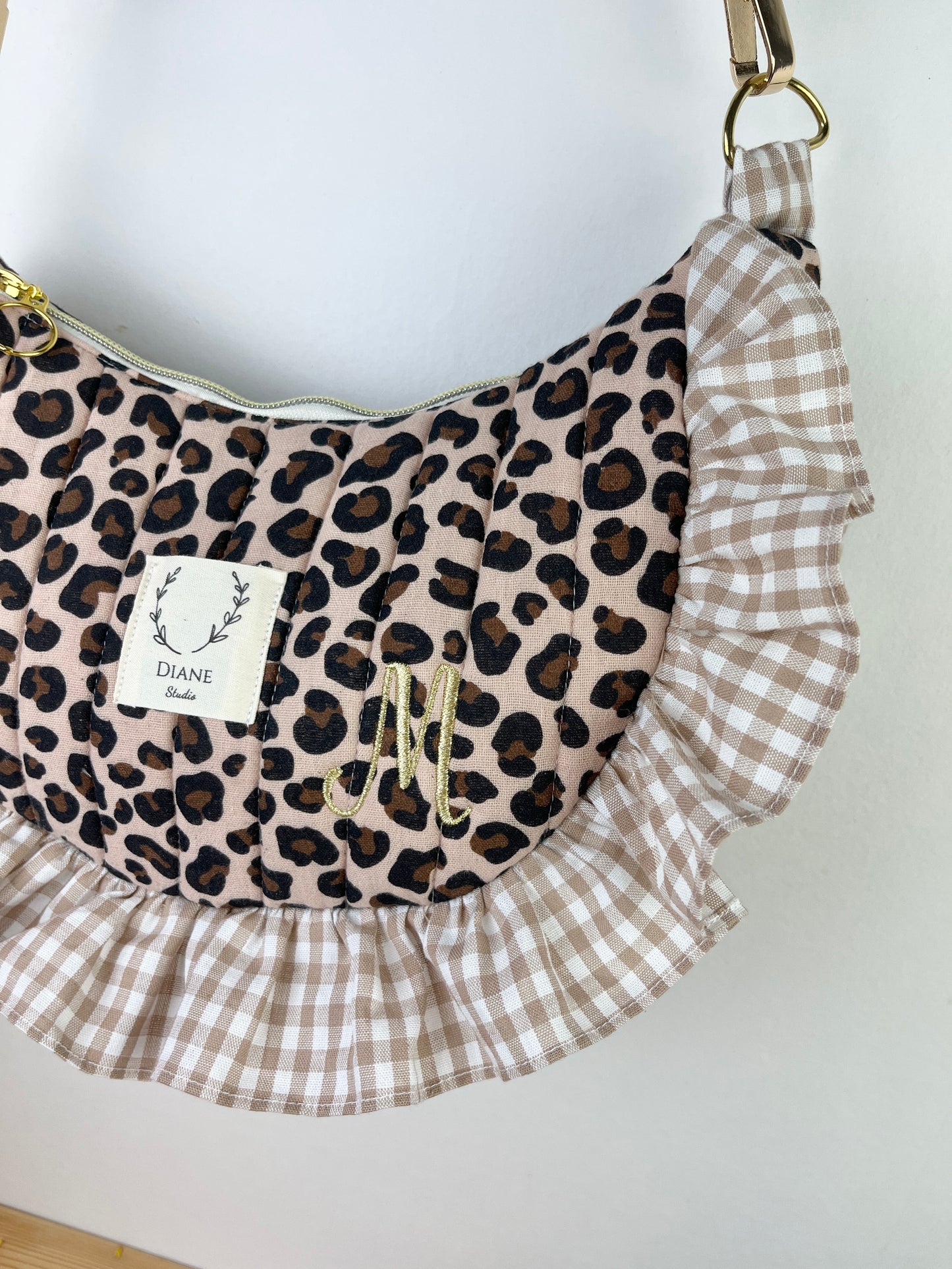 Milan the quilted crescent bag in leopard and beige gingham