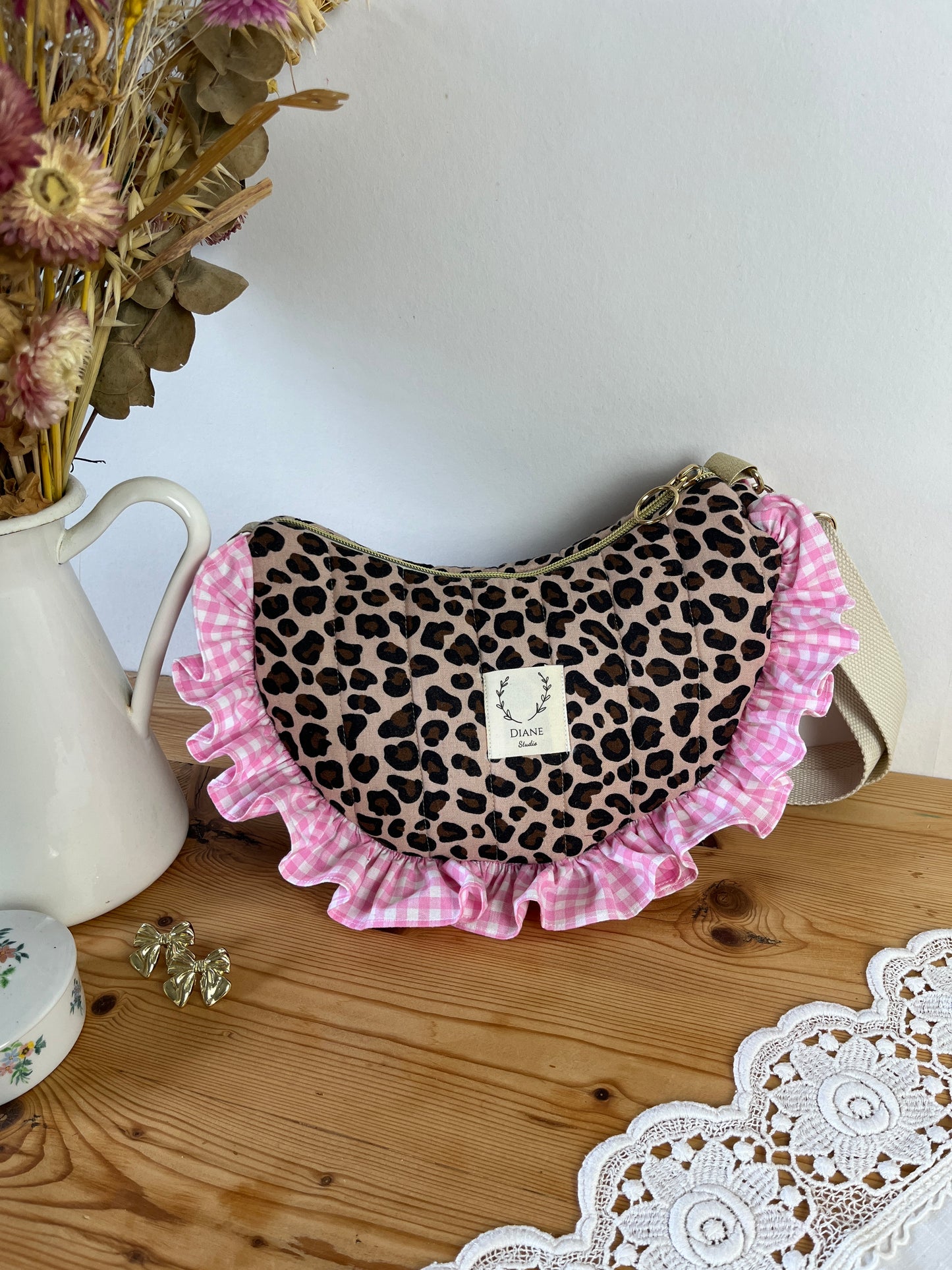 Milan the quilted crescent bag in leopard and beige gingham