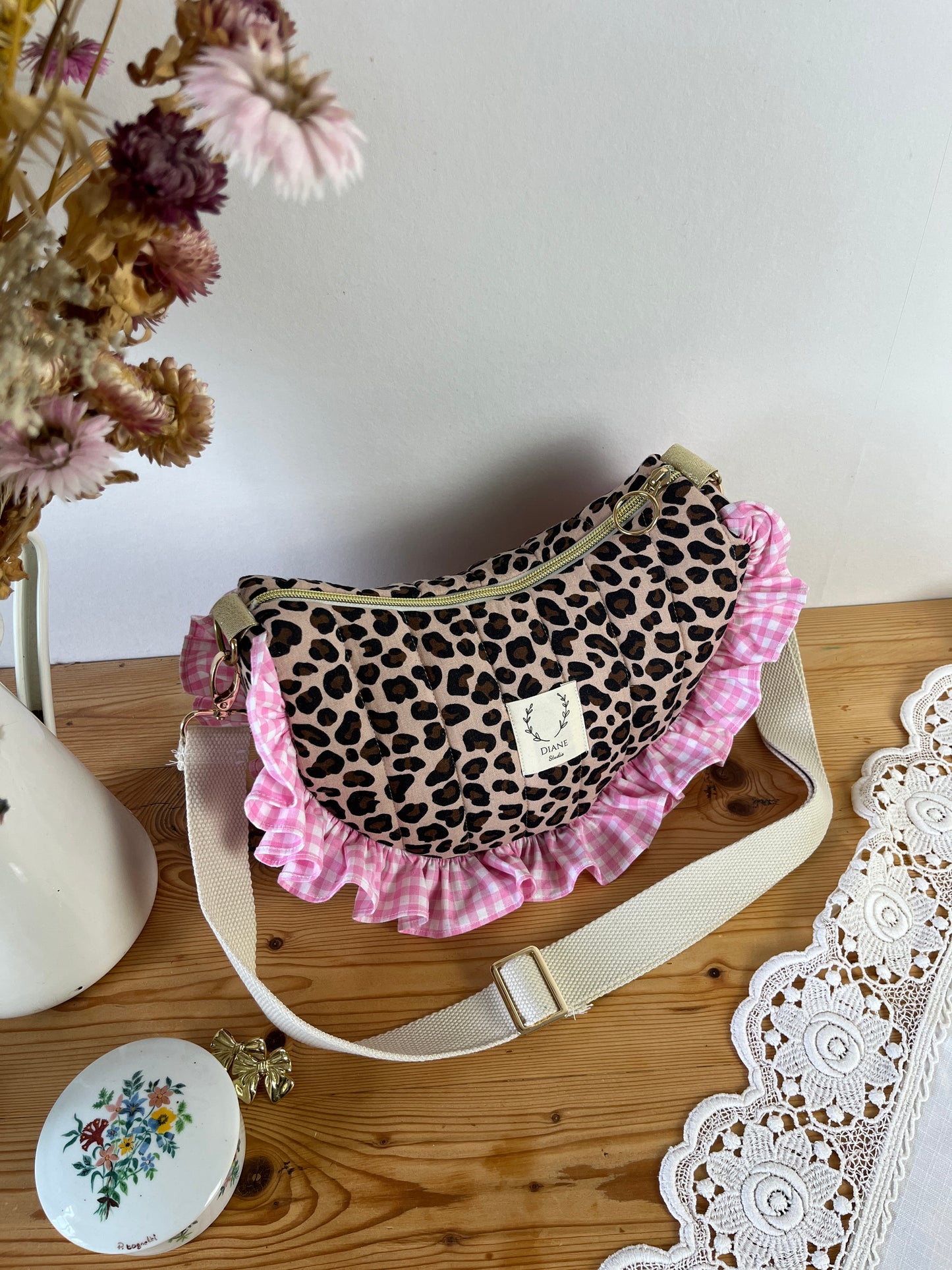 Milan the quilted crescent bag in leopard and beige gingham