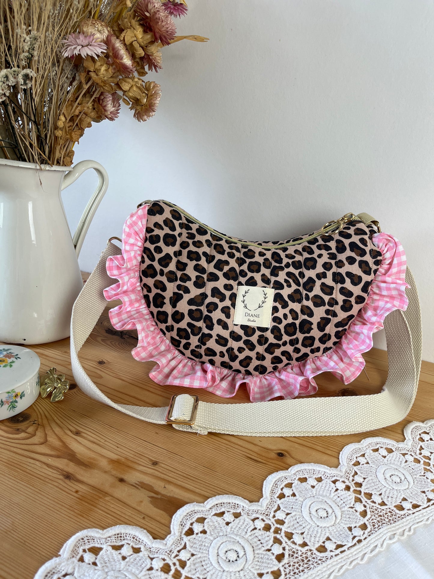 Milan the quilted crescent bag in leopard and beige gingham