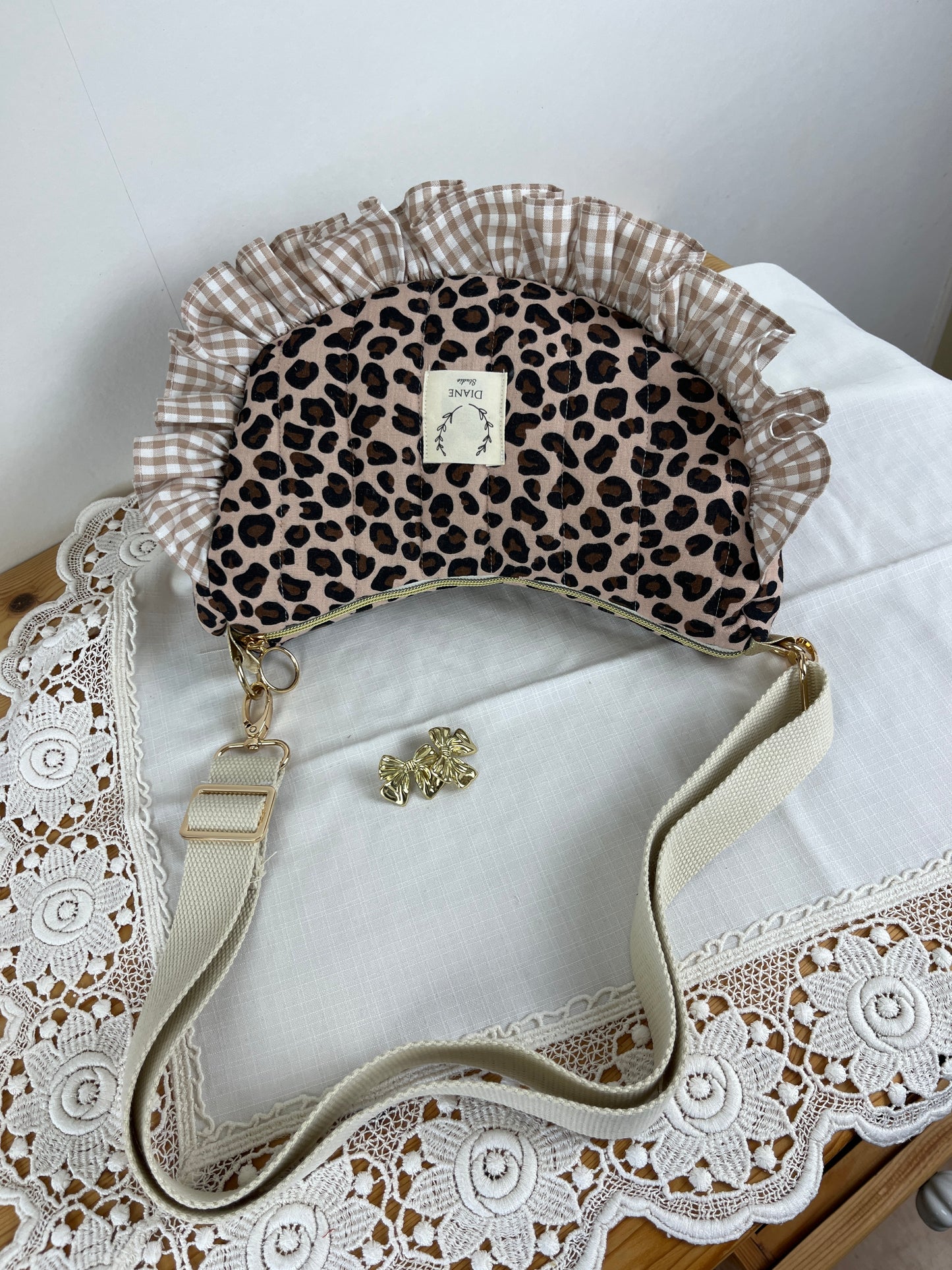 Milan the quilted crescent bag in leopard and beige gingham