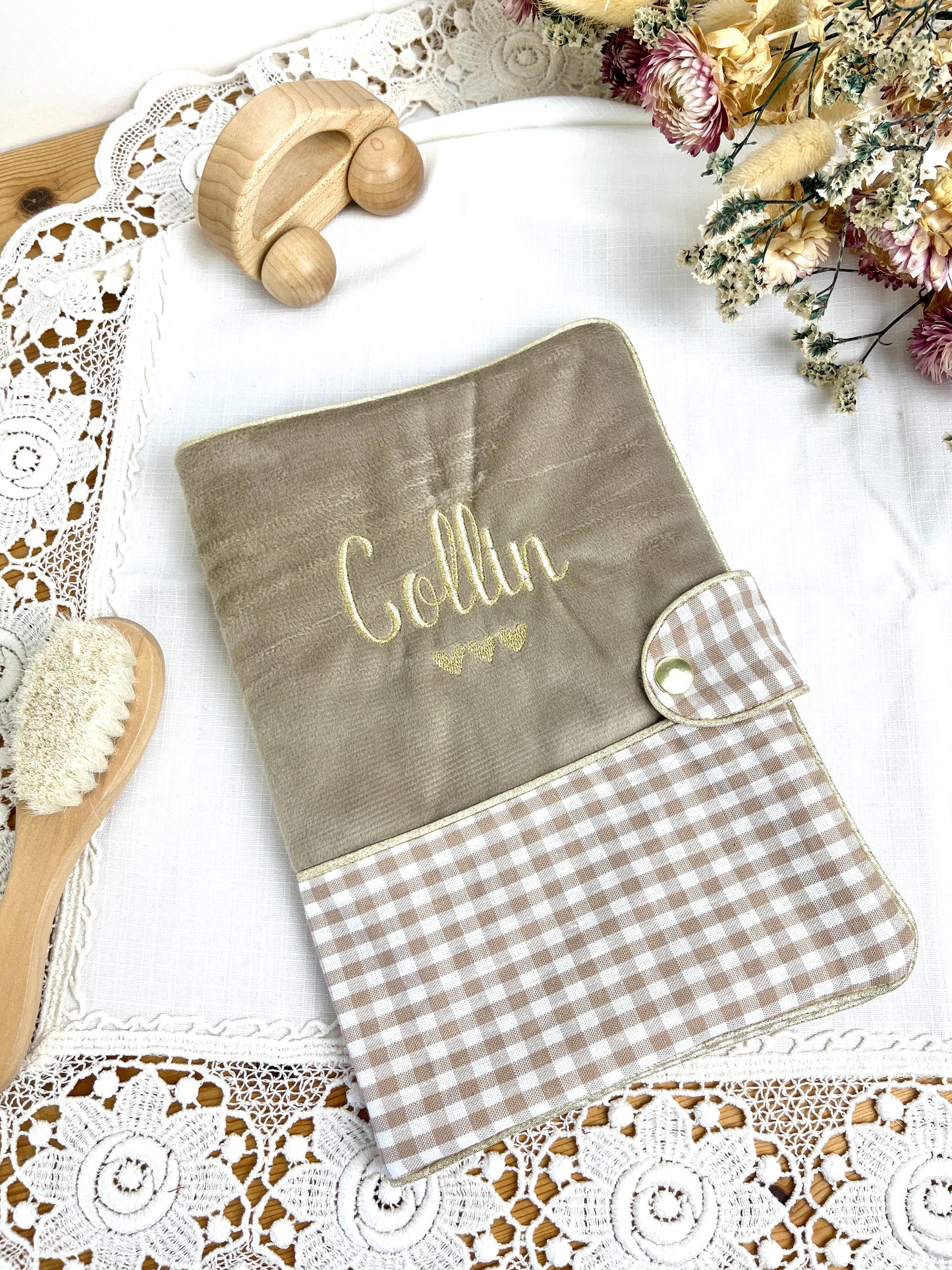 Set includes: Toiletry bag, blanket, doll, notebook cover, and bonnet 