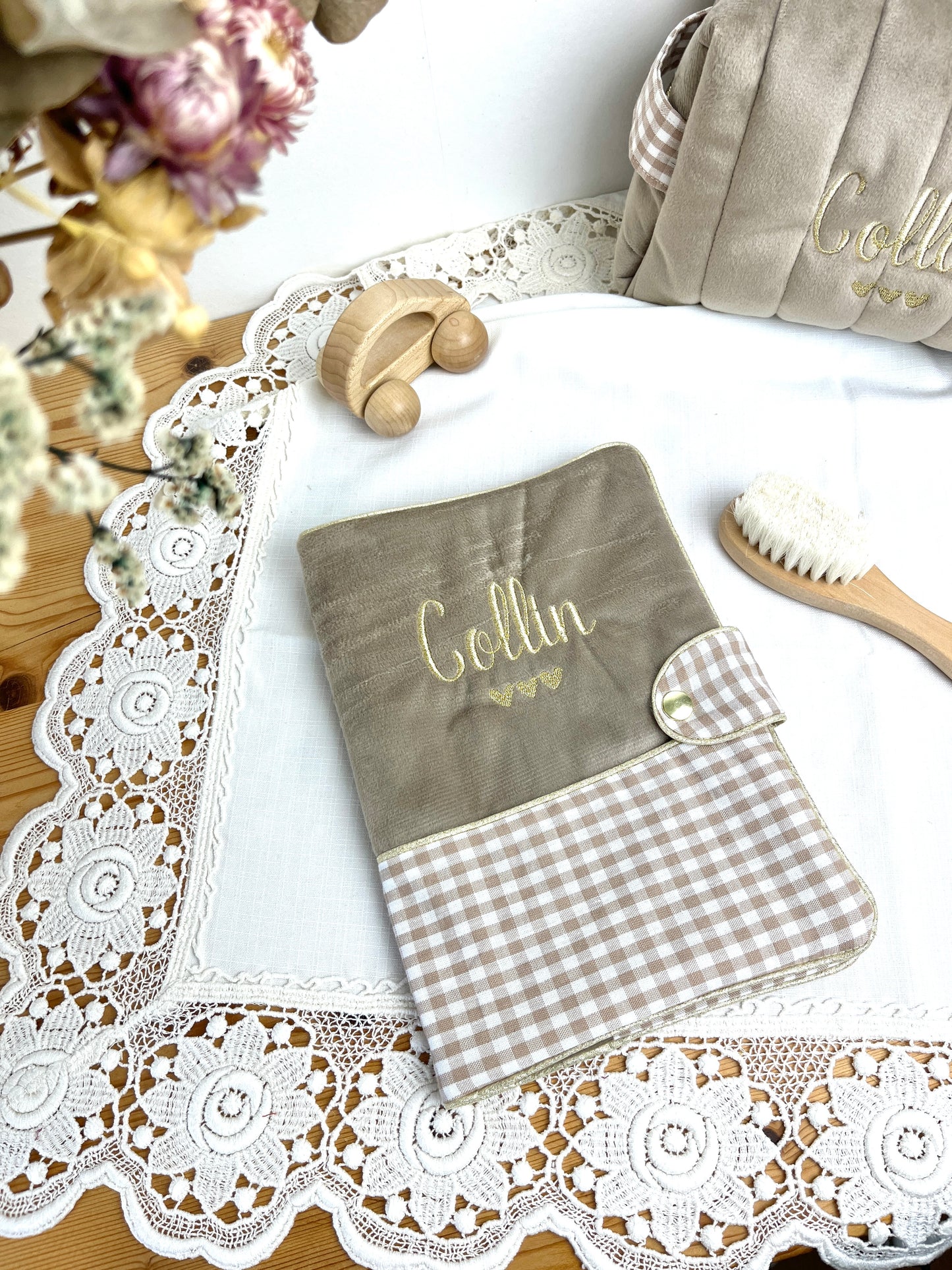 Set includes: Toiletry bag, blanket, doll, notebook cover, and bonnet 