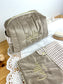 Set includes: Toiletry bag, blanket, doll, notebook cover, and bonnet 