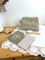 Set includes: Toiletry bag, blanket, doll, notebook cover, and bonnet 