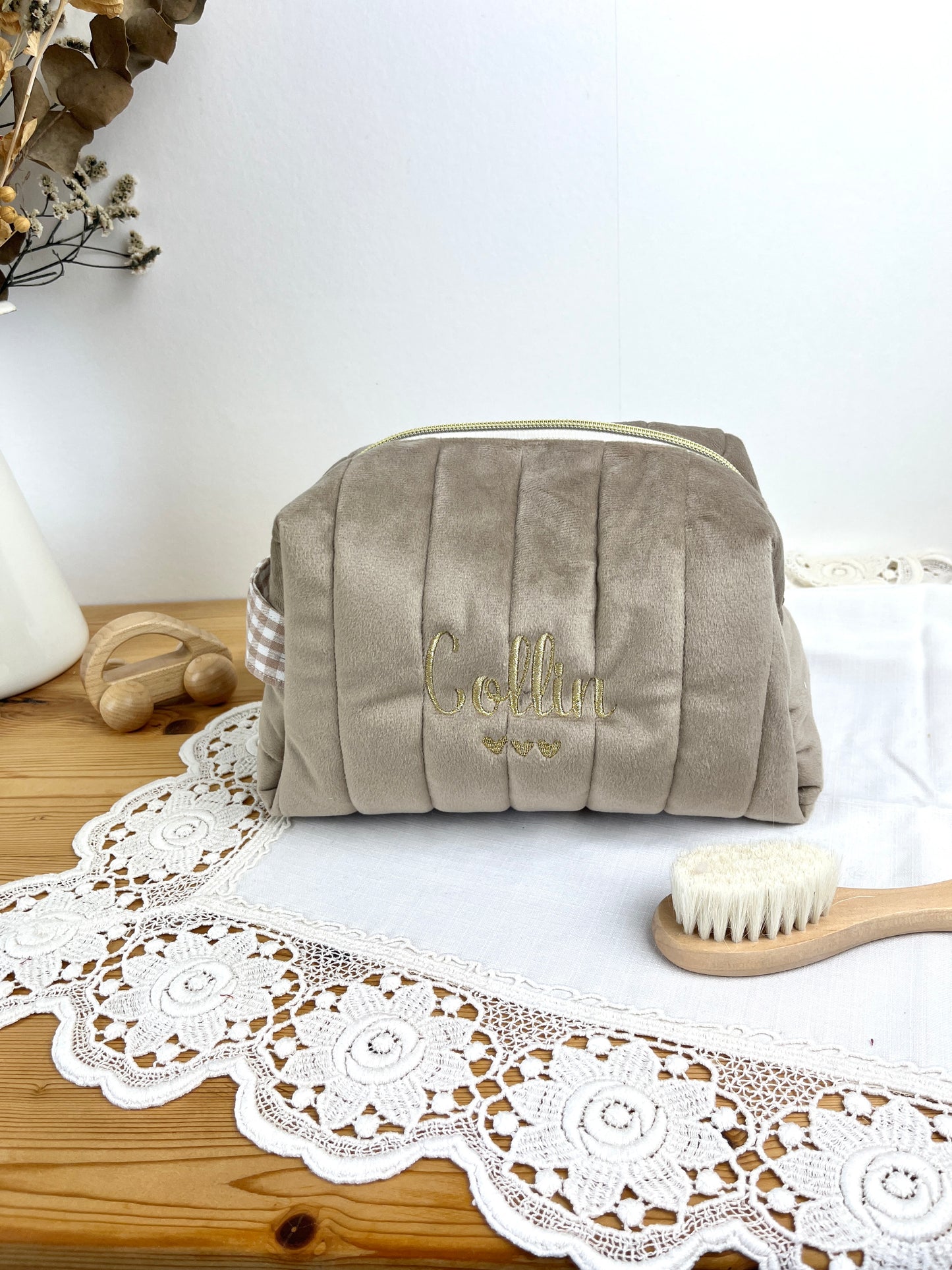 Set includes: Toiletry bag, blanket, doll, notebook cover, and bonnet 