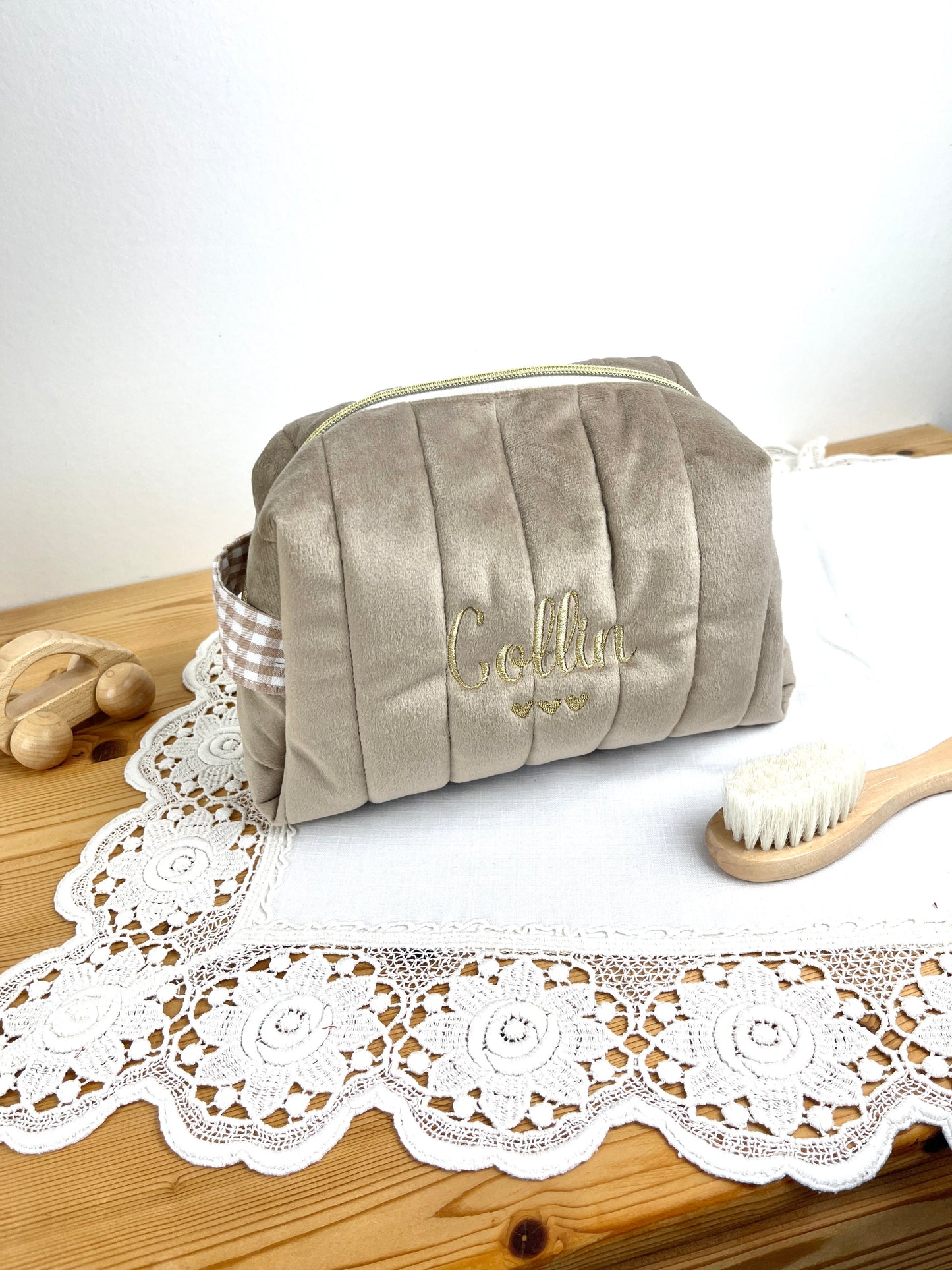Set includes: Toiletry bag, blanket, doll, notebook cover, and bonnet 