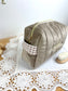 Set includes: Toiletry bag, blanket, doll, notebook cover, and bonnet 