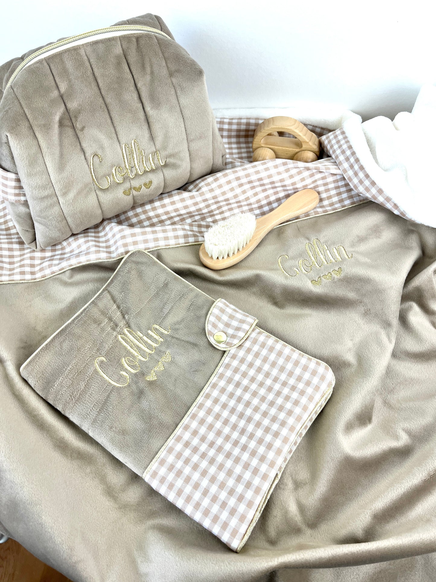 Set includes: Toiletry bag, blanket, doll, notebook cover, and bonnet 