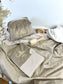 Set includes: Toiletry bag, blanket, doll, notebook cover, and bonnet 