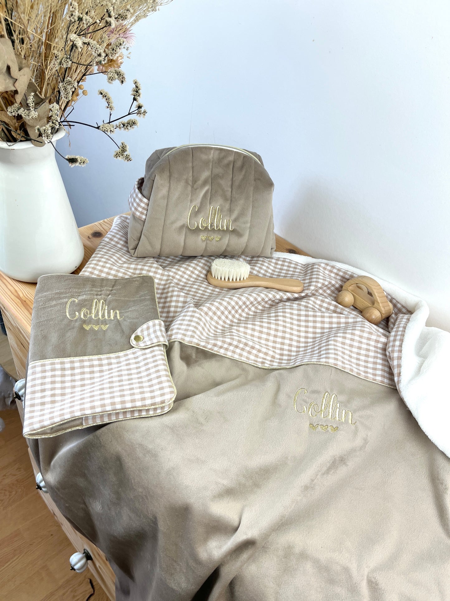 Set includes: Toiletry bag, blanket, doll, notebook cover, and bonnet 