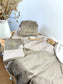 Set includes: Toiletry bag, blanket, doll, notebook cover, and bonnet 