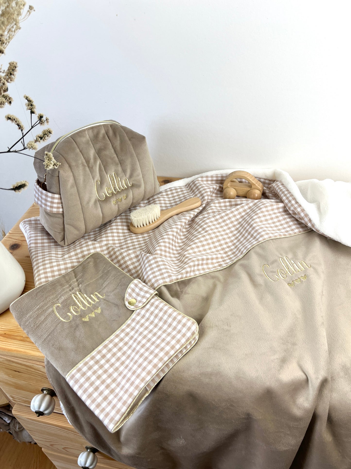Set includes: Toiletry bag, blanket, doll, notebook cover, and bonnet 