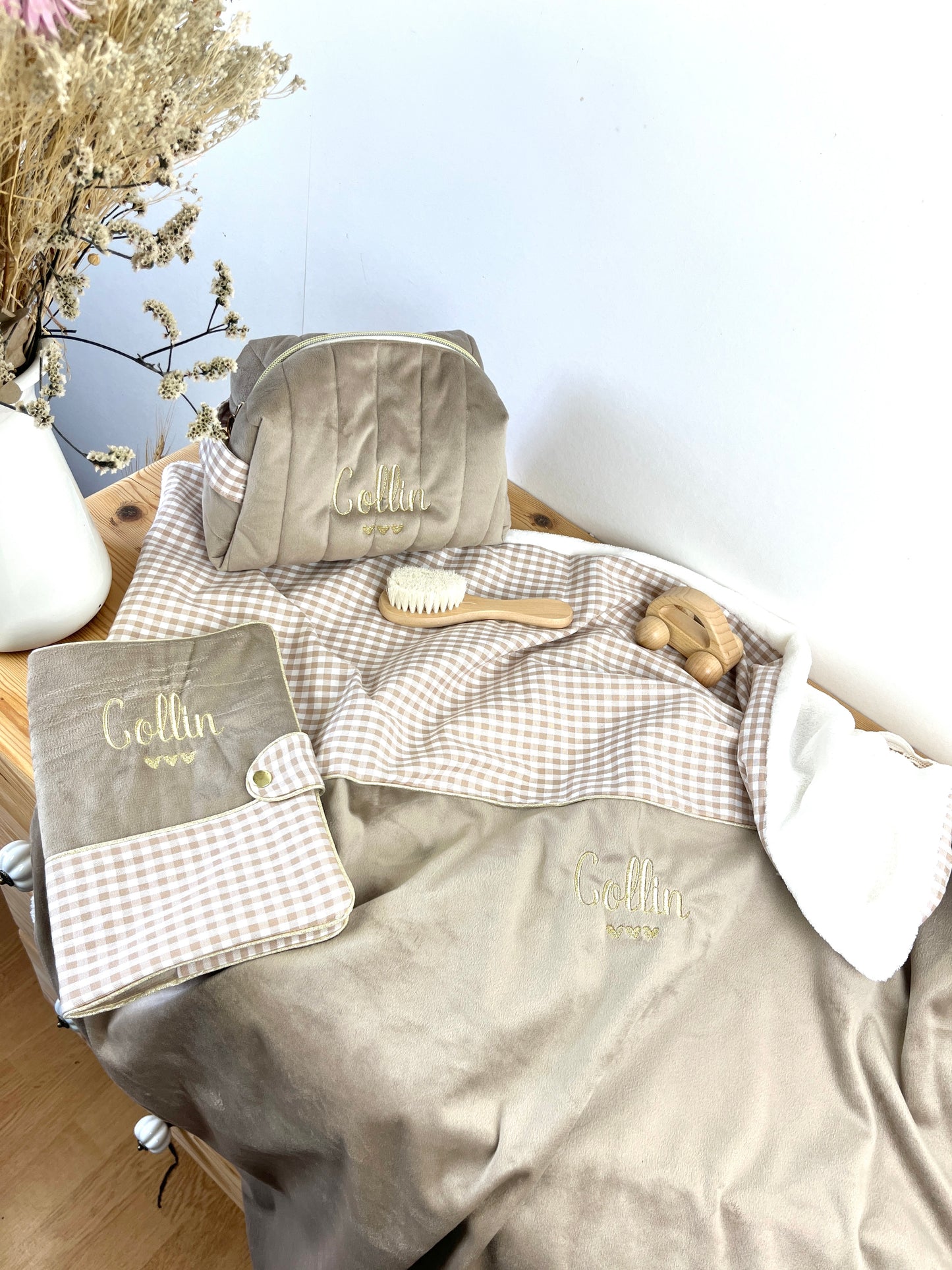 Set includes: Toiletry bag, blanket, doll, notebook cover, and bonnet 