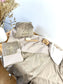 Set includes: Toiletry bag, blanket, doll, notebook cover, and bonnet 