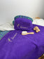 Set includes: Toiletry bag, blanket, doll, notebook cover, and bonnet 