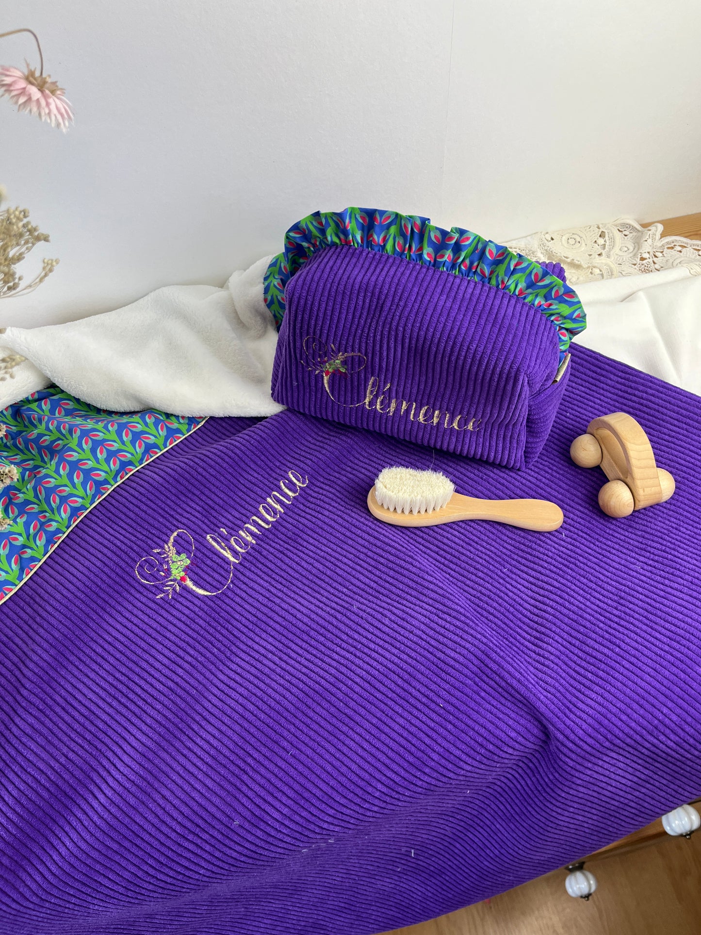 Set includes: Toiletry bag, blanket, doll, notebook cover, and bonnet 