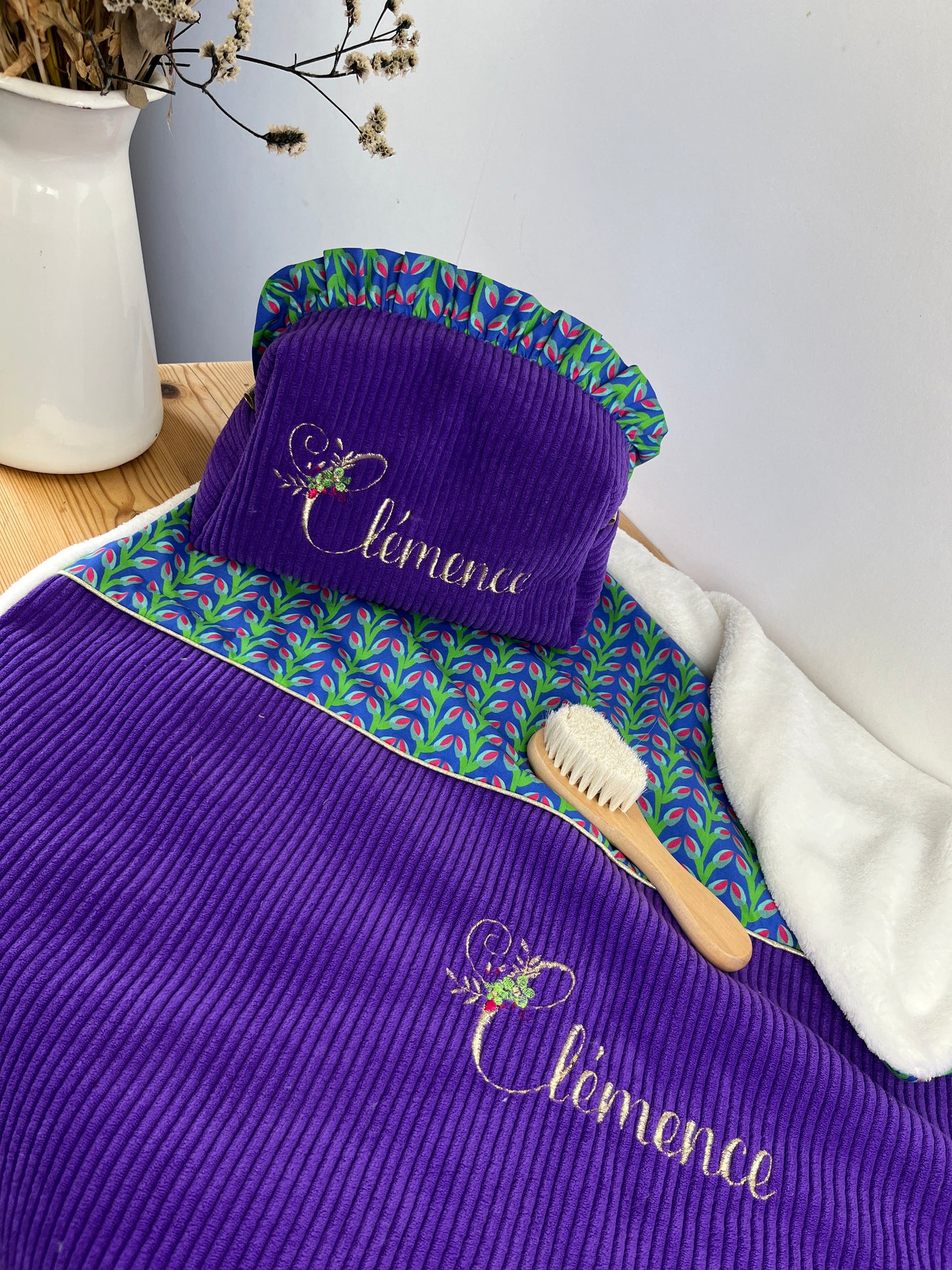 Set includes: Toiletry bag, blanket, doll, notebook cover, and bonnet 