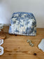 Colette's quilted toiletry bag and its bow