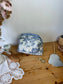 Colette's quilted toiletry bag and its bow