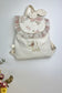 The Eglantine jacquard pink glitter backpack