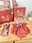 Set includes: diaper bag, notebook cover, doll, bloomers, and headband 