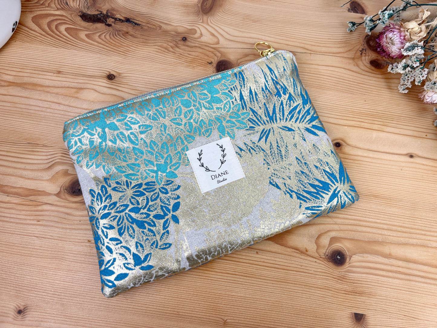 Babette the flat clutch with golden foliage