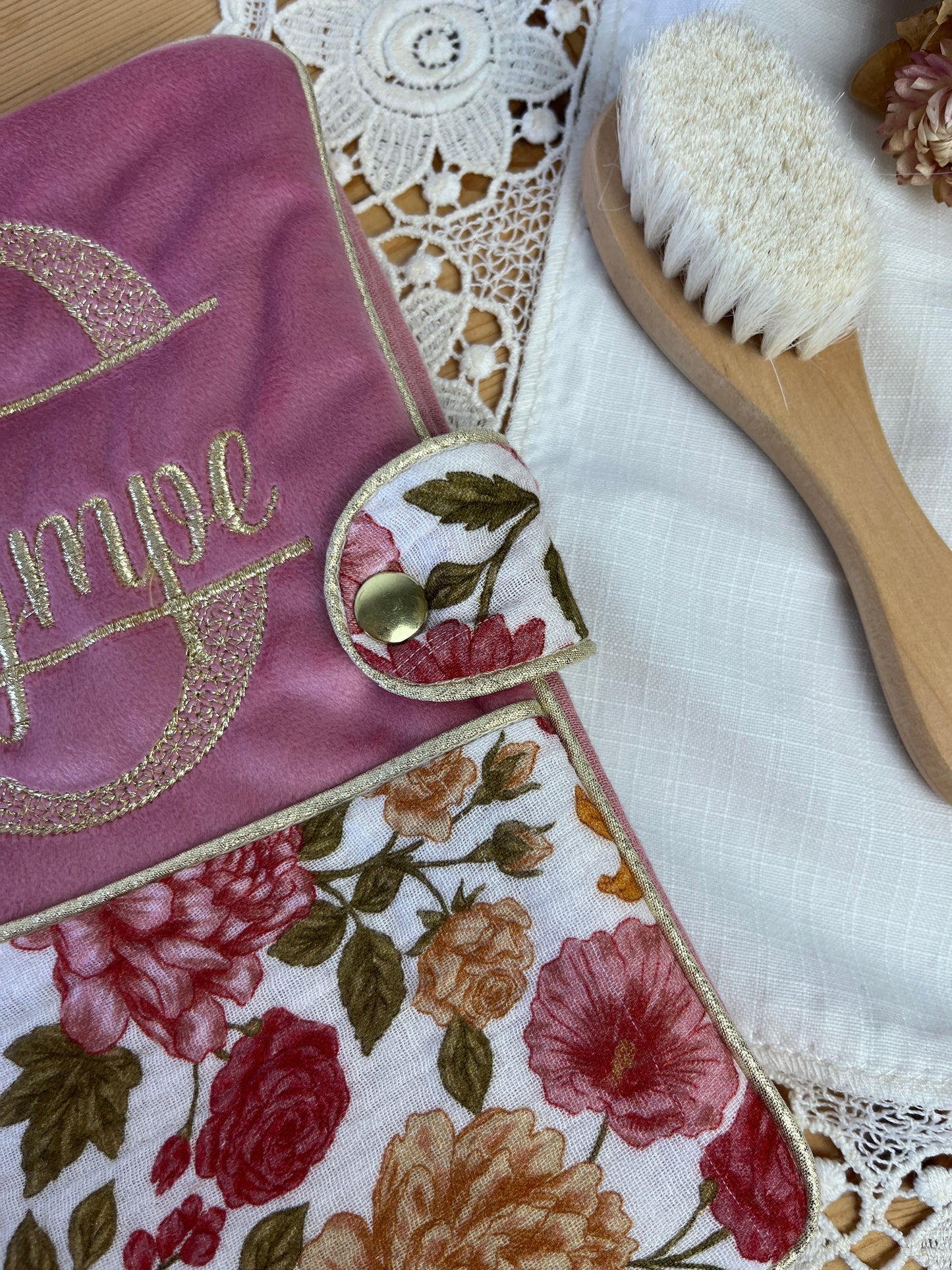 Set includes: Toiletry bag, blanket, doll, notebook cover, and bonnet 
