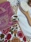Set includes: Toiletry bag, blanket, doll, notebook cover, and bonnet 