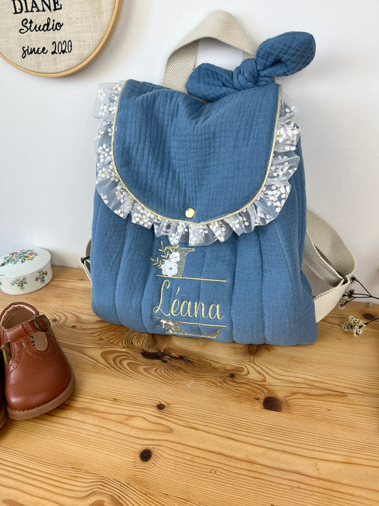 Le sac à dos Églantine gaze indigo et tulle fleuri doré