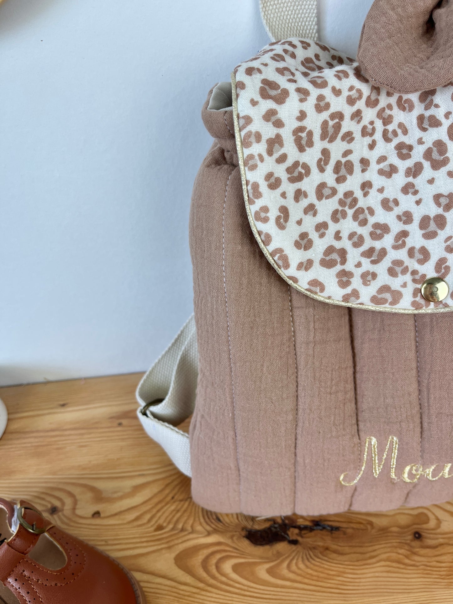 Set includes: Toiletry bag, blanket, doll, notebook cover, and bonnet 